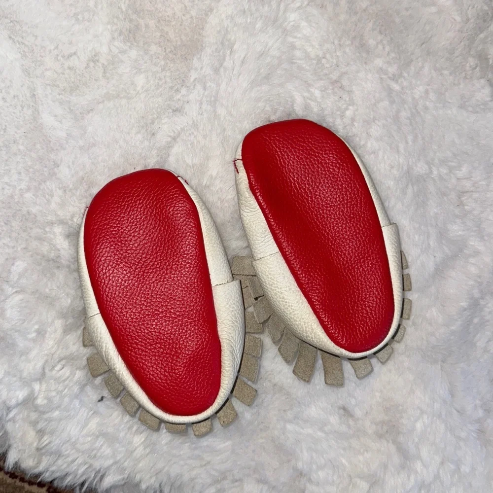BirdRock Baby Home Run genuine leather baby moccasins with a baseball design.